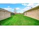 Beautifully maintained backyard featuring a lush green lawn and privacy fence at 8242 Frankdale Ct, Indianapolis, IN 46259