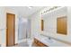 Bright bathroom with wood vanity, framed mirror and shower with glass door at 8242 Frankdale Ct, Indianapolis, IN 46259