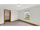 Neutral bedroom featuring a window and closet at 8242 Frankdale Ct, Indianapolis, IN 46259