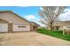 Charming brick home with attached two-car garage and well-manicured lawn at 8242 Frankdale Ct, Indianapolis, IN 46259
