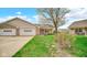Single-Gathering home showcasing an attached garage, manicured lawn, and mature tree at 8242 Frankdale Ct, Indianapolis, IN 46259