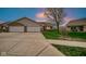 Charming home with a two-car garage and manicured lawn at sunset at 8242 Frankdale Ct, Indianapolis, IN 46259
