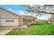 Single-story brick home featuring a covered entry, attached garage, and fresh landscaping at 8242 Frankdale Ct, Indianapolis, IN 46259