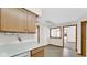 View from the kitchen towards the dining room with an open serving window at 8242 Frankdale Ct, Indianapolis, IN 46259