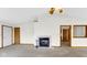 Cozy living room featuring a fireplace, neutral carpet, and access to other rooms at 8242 Frankdale Ct, Indianapolis, IN 46259