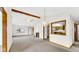 Bright living room features beamed ceilings, fireplace, and a pass-through to the kitchen at 8242 Frankdale Ct, Indianapolis, IN 46259