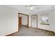 Neutral living room featuring a ceiling fan, window and exterior door at 8242 Frankdale Ct, Indianapolis, IN 46259