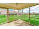 Enclosed patio with a view of the expansive yard, pond and surrounding greenery at 8242 Frankdale Ct, Indianapolis, IN 46259