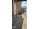 Townhouse front door with brick exterior and stone landscaping, enhancing curb appeal at 8277 Sobax Dr, Indianapolis, IN 46268