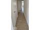 Hallway featuring neutral color palette, new laminated flooring, and clean sight lines to other rooms at 8277 Sobax Dr, Indianapolis, IN 46268