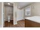 Bathroom featuring a toilet and walk in shower, adjacent to vanity area and sink at 8722 Shelby St, Indianapolis, IN 46227