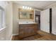 Bathroom with vanity, a large mirror, and a view into an adjacent shower area at 8722 Shelby St, Indianapolis, IN 46227