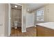 Bathroom featuring a toilet and walk in shower, adjacent to vanity area and sink at 8722 Shelby St, Indianapolis, IN 46227