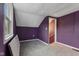 Bedroom featuring grey carpet, purple walls, and a window with natural light at 8722 Shelby St, Indianapolis, IN 46227