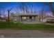 Charming home featuring a welcoming porch with a ramp and a well-maintained front yard at 8722 Shelby St, Indianapolis, IN 46227