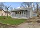 Cozy home displaying a covered front porch with ramp access and neat landscaping at 8722 Shelby St, Indianapolis, IN 46227
