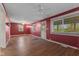 Spacious living room featuring hardwood floors and a ceiling fan at 8722 Shelby St, Indianapolis, IN 46227