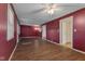 Open living room featuring vinyl floors, ample lighting, and neutral paint at 8722 Shelby St, Indianapolis, IN 46227