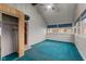 Bright sunroom with vaulted ceiling, large windows, and blue carpeting at 8722 Shelby St, Indianapolis, IN 46227