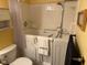 Bathroom features a Safe Step Walk-in Tub, shower, toilet, and storage cabinet at 8820 Yardley Ct # 103, Indianapolis, IN 46268