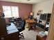 Home office with a desk, chair, round table, and ample storage for organization at 8820 Yardley Ct # 103, Indianapolis, IN 46268