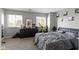 Cozy bedroom with natural light, a dark dresser, and comfortable furnishings at 9442 Avon Strand # D, Avon, IN 46123