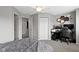 Bedroom featuring three doors, a gaming setup, and a walk-in closet at 9442 Avon Strand # D, Avon, IN 46123