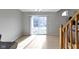 Bright dining area with sliding glass doors and tiled floors, leading to outdoor space at 9442 Avon Strand # D, Avon, IN 46123