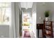 Inviting entryway with a view to the front yard, featuring tiled floor and neutral decor at 9442 Avon Strand # D, Avon, IN 46123