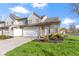 Charming townhome with attached garage, brick accents, lush lawn, and welcoming curb appeal at 9442 Avon Strand # D, Avon, IN 46123