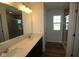 Bright bathroom featuring a glass enclosed shower and a double sink vanity with white countertops at 10027 Redwood Peak Ln, Indianapolis, IN 46259