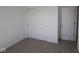 Neutral bedroom with carpeted floors featuring a large closet with sliding doors for optimized storage at 10027 Redwood Peak Ln, Indianapolis, IN 46259