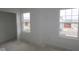 Well-lit room with two windows offering natural light and an open door at 10027 Redwood Peak Ln, Indianapolis, IN 46259