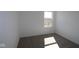 A well-lit room with carpeted floors and fresh white paint offering a blank canvas for your personal touch at 10027 Redwood Peak Ln, Indianapolis, IN 46259