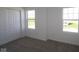 Bright bedroom featuring carpeted floors, fresh white paint and natural light from two windows at 10027 Redwood Peak Ln, Indianapolis, IN 46259