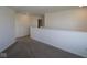 Hallway featuring neutral decor and carpeted floors, leading to other parts of the home at 10027 Redwood Peak Ln, Indianapolis, IN 46259