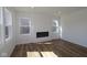 Bright living room with a modern fireplace and large windows offering ample natural light at 10027 Redwood Peak Ln, Indianapolis, IN 46259