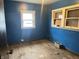 Cozy bedroom featuring hardwood floors and two bright windows at 1047 N Concord St, Indianapolis, IN 46222