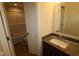 Well-lit bathroom featuring a modern vanity, sink, and a shower/tub combo for convenience at 10543 Banyan Wood Ct, Indianapolis, IN 46239