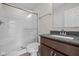 Bathroom boasts a shower with glass doors and a vanity with granite countertop at 10543 Banyan Wood Ct, Indianapolis, IN 46239