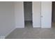 Comfortable bedroom with soft carpeting, a closet, and a simple, clean aesthetic at 10543 Banyan Wood Ct, Indianapolis, IN 46239