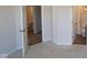 Bedroom view showcasing entry to an en-suite bathroom with modern fixtures at 10543 Banyan Wood Ct, Indianapolis, IN 46239