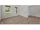 Bright bedroom featuring hardwood floors and a view of the street at 10543 Banyan Wood Ct, Indianapolis, IN 46239