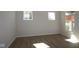 Neutral bedroom featuring hardwood floors and abundant light at 10543 Banyan Wood Ct, Indianapolis, IN 46239