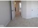 Bedroom featuring neutral carpet and multiple doors at 10543 Banyan Wood Ct, Indianapolis, IN 46239