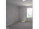 Bedroom featuring neutral carpet and a large window at 10543 Banyan Wood Ct, Indianapolis, IN 46239