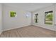 Simple and clean bedroom featuring three bright windows and hardwood floors at 10543 Banyan Wood Ct, Indianapolis, IN 46239