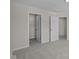 Neutral bedroom featuring a walk-in closet and a door to another room at 10543 Banyan Wood Ct, Indianapolis, IN 46239