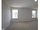 Spacious bedroom with plush carpeting, natural light from two windows, and freshly painted walls at 10543 Banyan Wood Ct, Indianapolis, IN 46239