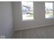 Bright bedroom with views through two large windows, offering plenty of natural light and a serene atmosphere at 10543 Banyan Wood Ct, Indianapolis, IN 46239